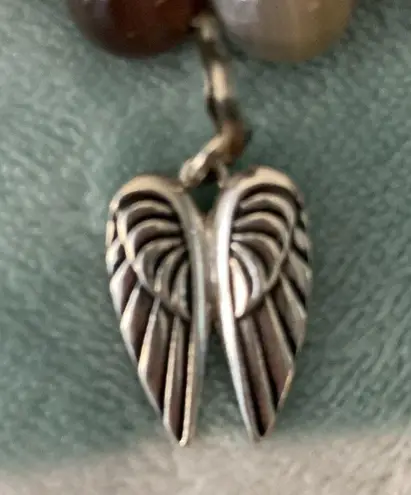 Agate 7 1/2” Bracelet. Angel wing pendant attached. Nice colors.