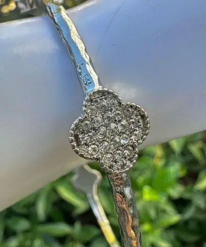 Silver tone clover bangle bracelet