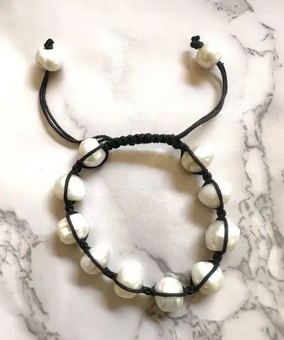 Pearl bracelet on adjustable black silk cord