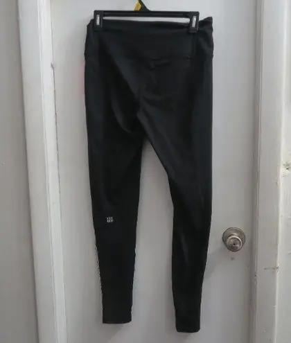 Victoria's Secret VSX sport knockout tight leggings in black, white and pink size medium.