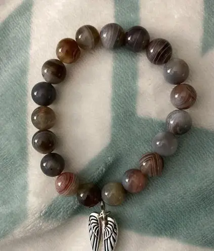 Agate 7 1/2” Bracelet. Angel wing pendant attached. Nice colors.