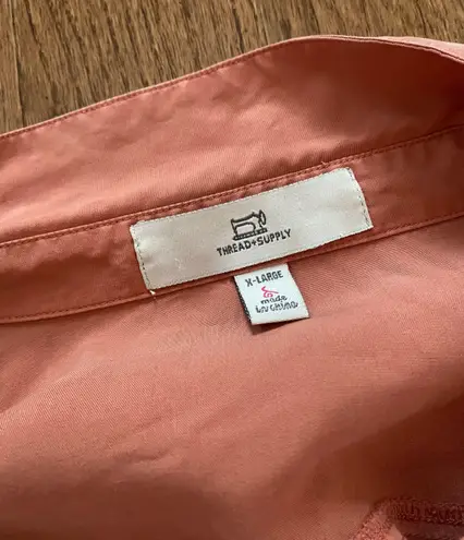 Thread and Supply  orange button up top