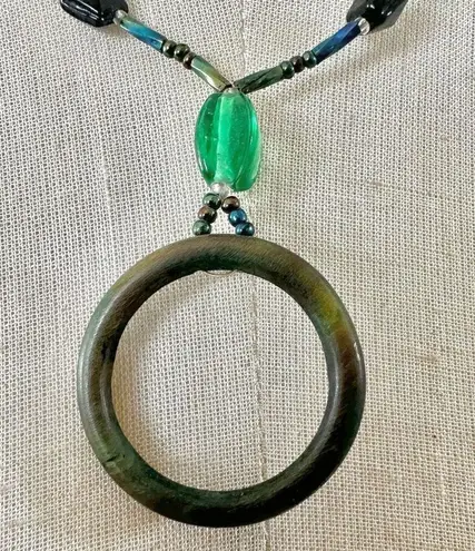 Green open circle beaded pendant necklace