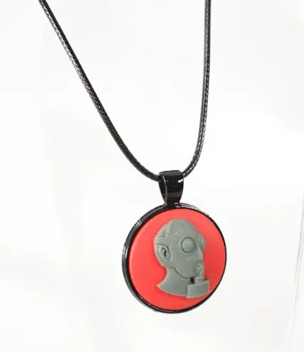 Unisex Punk Pendant on Black Toned Metal with Black Waxed Cord Red