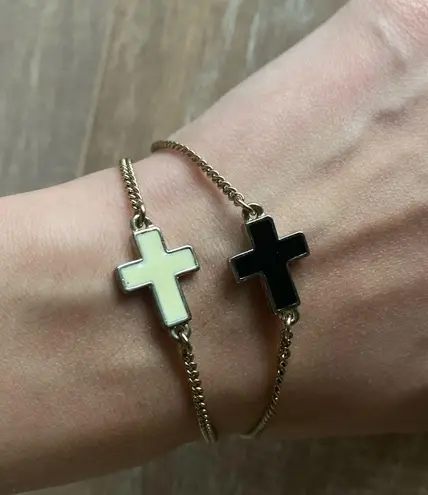 Urban Outfitters Ivory and black cross charm gold bracelets set