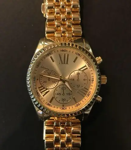 Gold colored womens watch