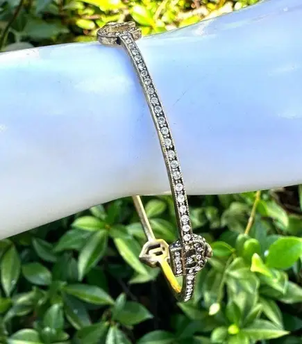 Juicy Couture  gold tone rhinestone logo thin bangle bracelet