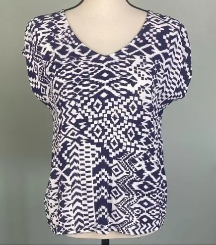 Skies Are Blue navy and white top with back cut-outs in size Medium. EUC