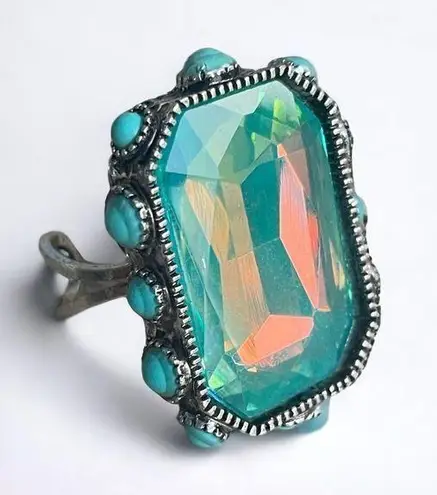 Blue crystal adjustable ring with round turquoise accents on sides