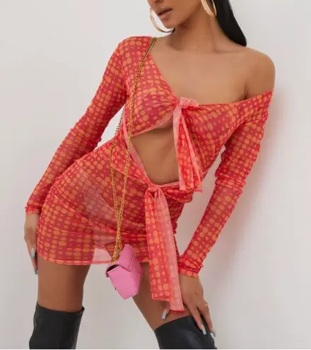 EGO LONG SLEEVE KNOTTED CUT OUT DETAIL MINI BODYCON DRESS IN PINK SPOTTY MESH