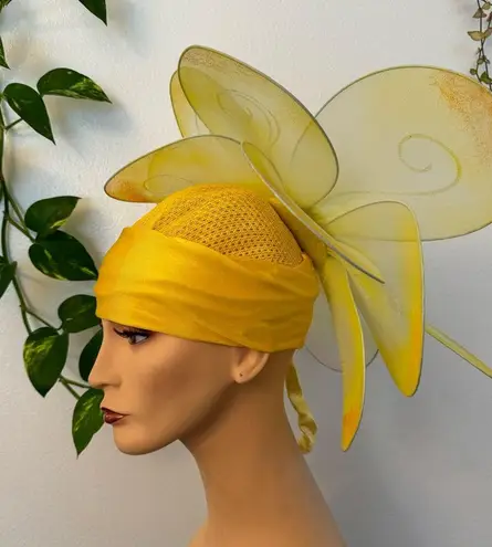 Handmade yellow floral hat. This hat was made for the stage in the theater.