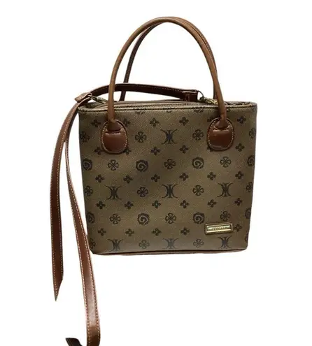 Rosetti purse. Dark taupe with brown leather handles and strap. Super cute