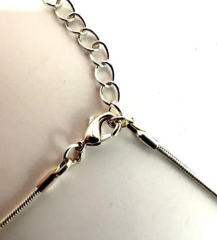 Silver tone blue cats eye dolphin pendant necklace