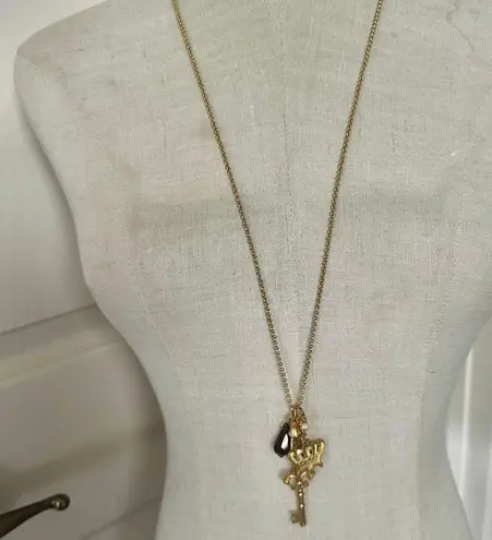 Mud Pie Gold Tone Charm Necklace Crown Key Fleur-de-Lis Purple Crystal