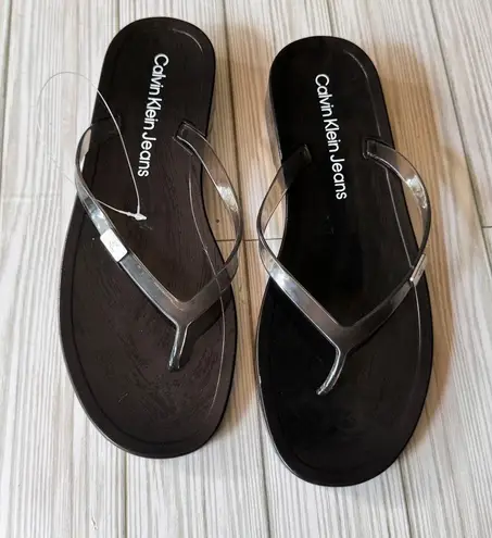 Calvin Klein Jeans Women's Black and Clear Logo Flip Flops Sz 8