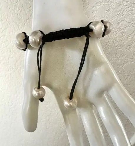 Pearl bracelet on adjustable black silk cord