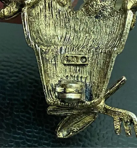 LIA Signed Pot of Flowers with Garden Tools Gold