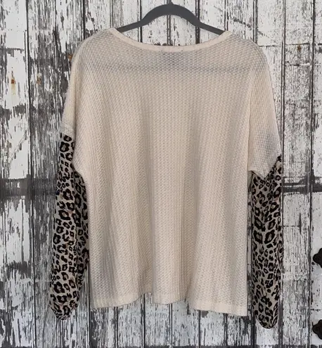 Discreet Cream waffle knit with cheetah sleeves top