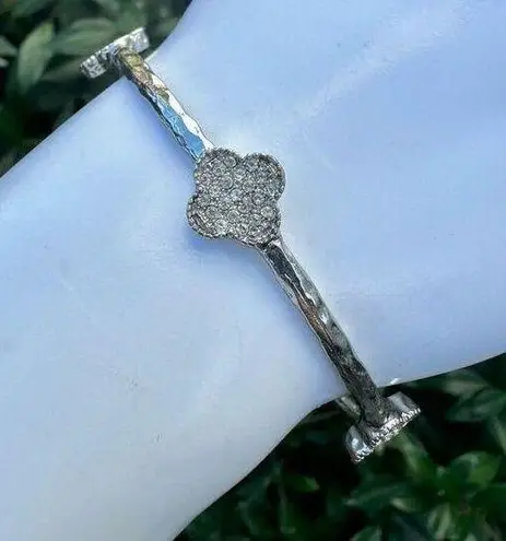 Silver tone clover bangle bracelet