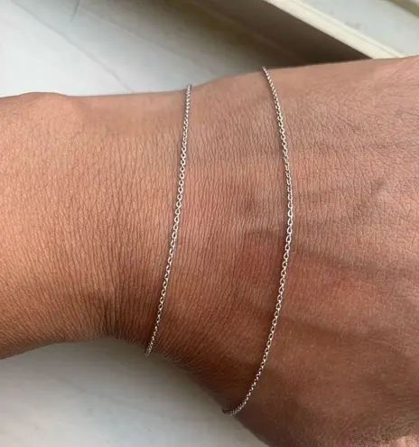 18k white gold chain with 14k gold solitaire charm