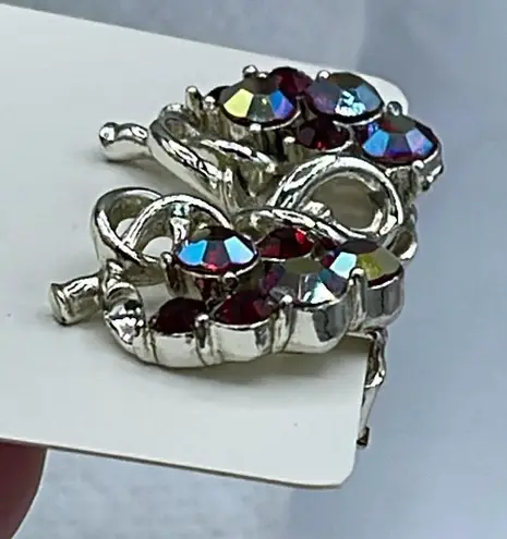 Vintage Star AB coated red cut glass silver tone metal clip earrings.