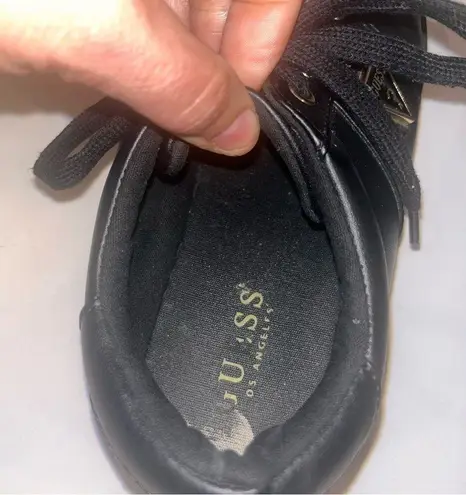 Guess  Beautiful black and gold flat tennis shoes size 9 with gold triangle logo