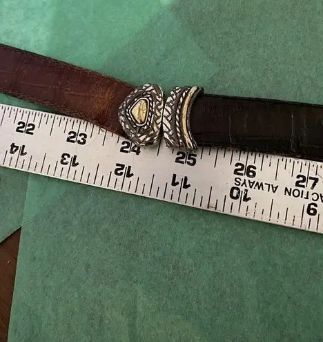 Ladies leather reversible belt black and brown with embellishments. Size med/30.