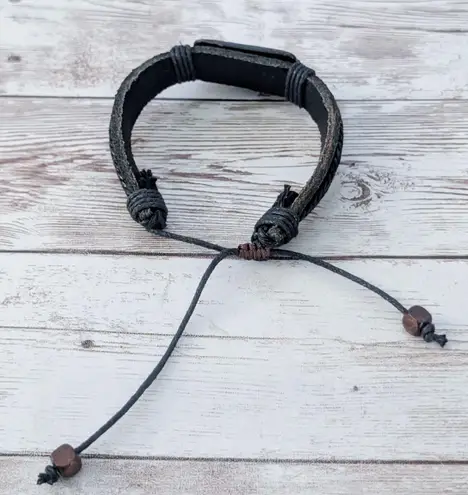 Leather? Tie Bracelet with Celtic Like Charm Black