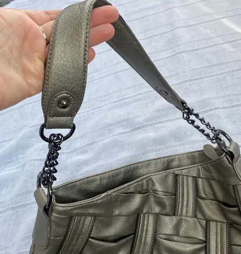 Olivia and Joy pewter hand bag with zipper embellishments.