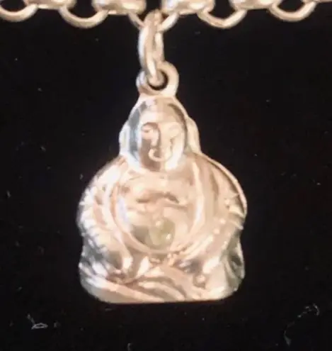 Sterling silver and peridot lucky charm bracelet.