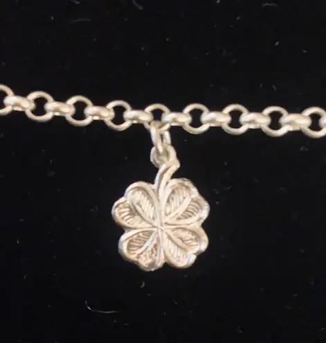 Sterling silver and peridot lucky charm bracelet.