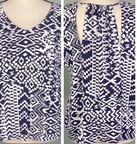 Skies Are Blue navy and white top with back cut-outs in size Medium. EUC
