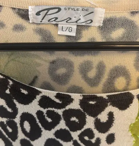 GOLD BLACK CREME COLORED TOP
STYLE DE PARIS BRAND ANIMAL PRINT FLOWERS W/ BLING Size L