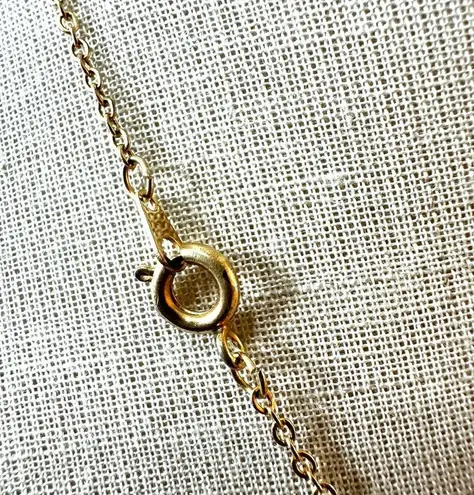 Gold tone faux diamond cross pendant necklace