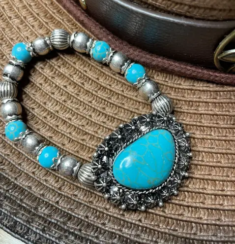 Western women’s faux turquoise and silver stretch bracelets. Blue