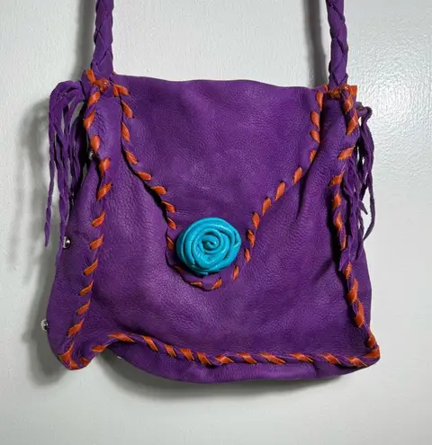 Purple dearskin leather medicine crossbody bag with orange and blue accents.
