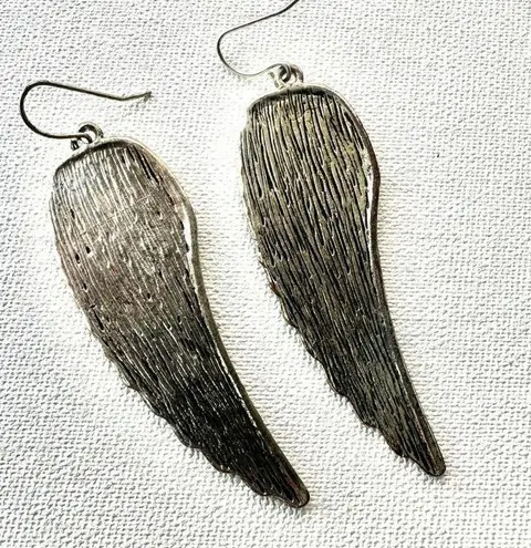 Silver tone angel wing earrings