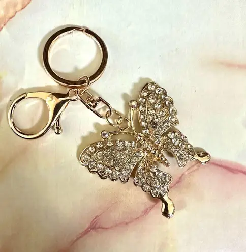 Gold tone butterfly rhinestone hang tag/keychain