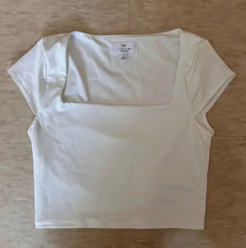 Live in the Moment white boat neck shirt