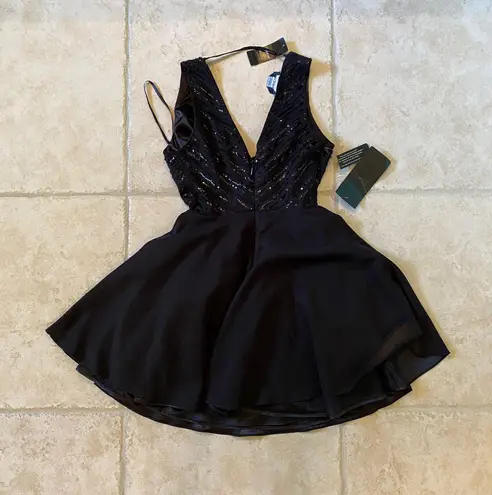 Bebe NWT  sparkly black mini dress