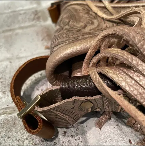 Deep brown and golden browns are stunning on this leather crossbody purse.