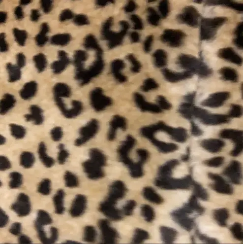 Faux fur animal pattern sweater vest. Size medium. Brown