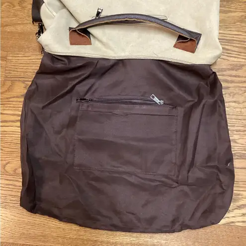 Classic Fashion Outback bag. Tan with pebbled leather handles and trim.