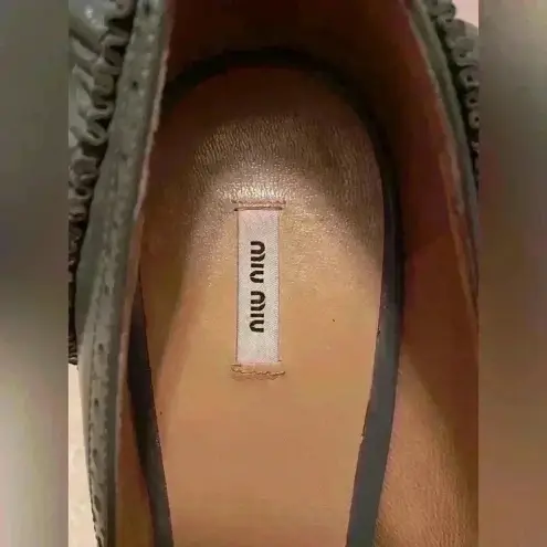 Miu Miu Italian, gray/black brogue leather pumps with ruffle heels; size 40.5