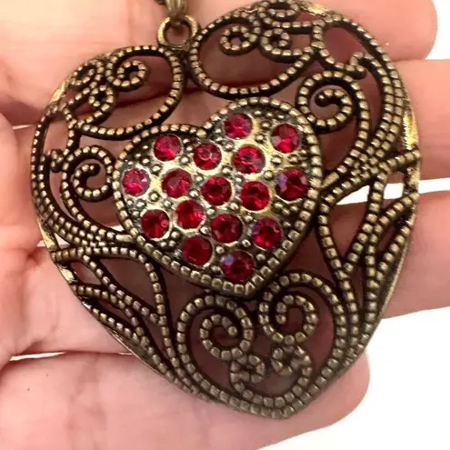 Brass tone red rhinestone heart pendant necklace