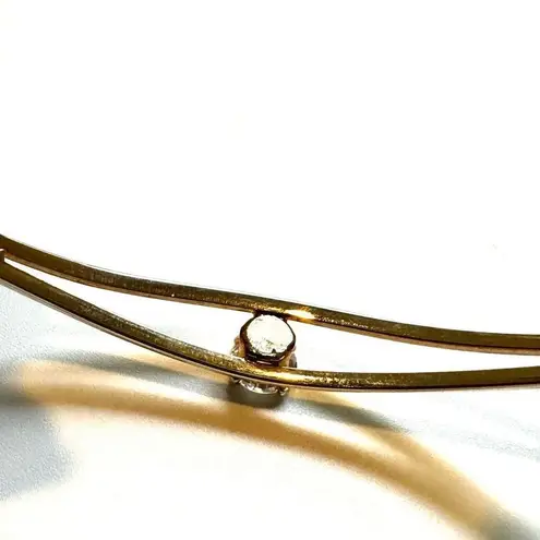 Gold tone open cuff rhinestone bracelet