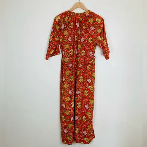 dRA Anthropologie orange and floral block print caftan midi dress. Size Small