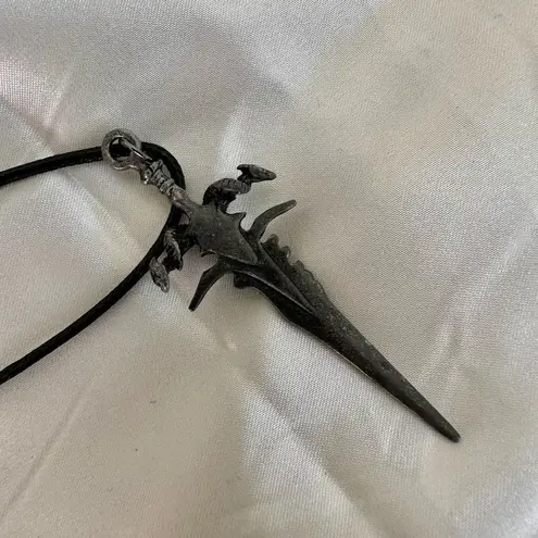 Silver tone sword necklace Gray
