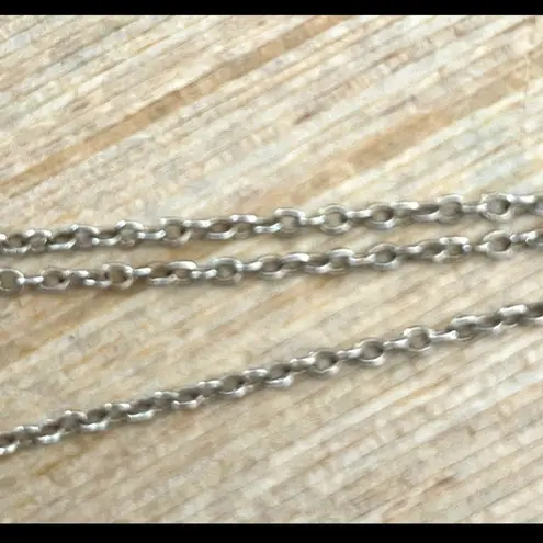 Long silver tone crystal necklace