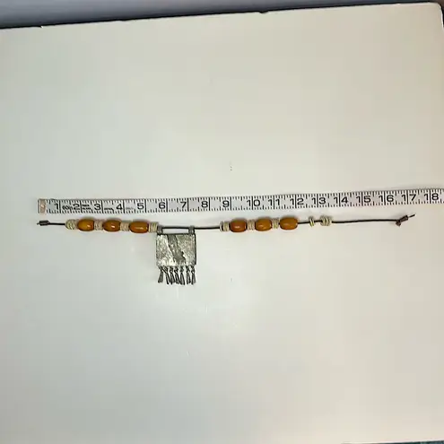 Handmade Vintage authentic African tribal necklace with metal center amber colored beads